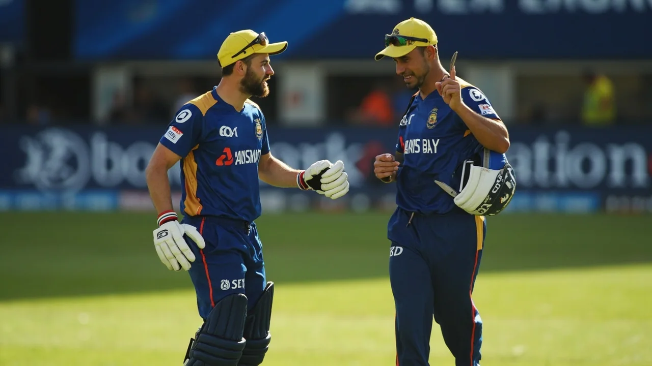 A captain conferring with bowlers at the end of an over during an IPL fixture, with fielders repositioning in the background and the scoreboard visible at the edge of the frame
